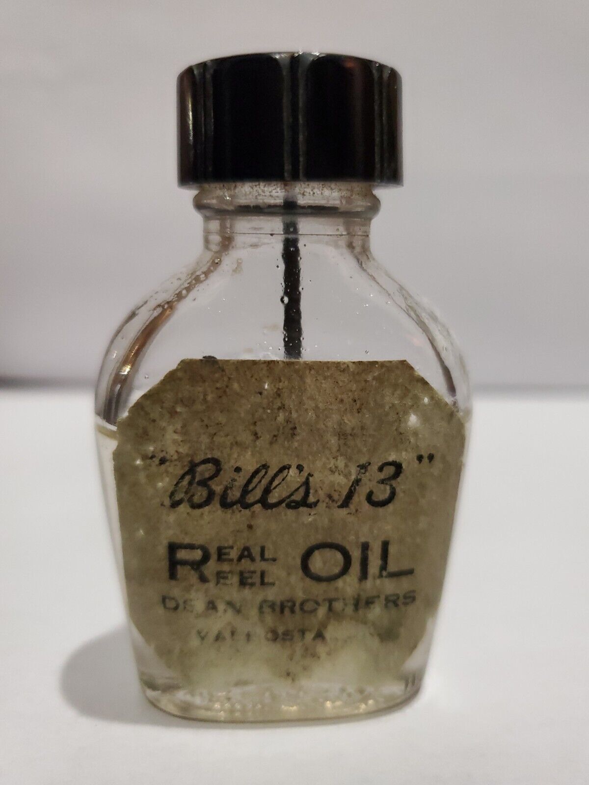 Bottle: Clear Glass, "bill's 13" Real Reel Oil, Dean Brothers, Valdosta, Georgia